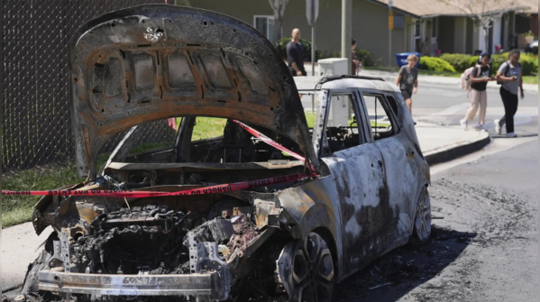 Charred car on street