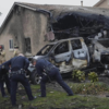 Officers inspect crash site
