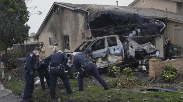 Officers inspect crash site