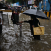 Mumbai Rain Live: Commuters wade through waterlogged streets on JB Marg in Parel amid heavy rain