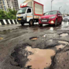 Mumbai Rains Live: Potholes emerge on Sion flyover as monsoon sets over the city on Monday