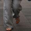 Grey baggy jeans with beige-hued Birkenstocks 