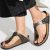 Black flared jeans with thong straps, Birkenstocks