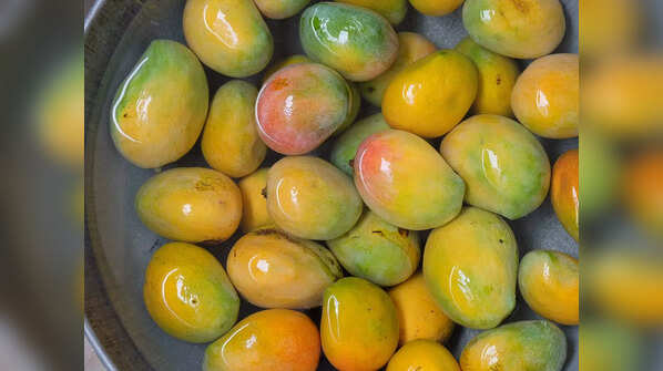 Why should you soak mangoes before eating?