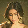 green emerald velvet dress Mouni Roy in gold tube long gown