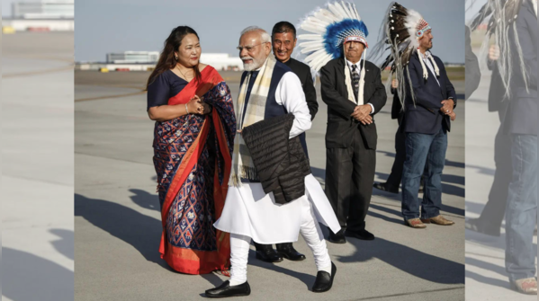 Greeting his hosts at G7 arrival