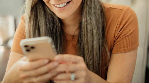 Using both hands, and using one thumb to scroll