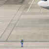 Ground staff bids goodbye to departing aircraft