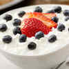Mixing curd with fruits