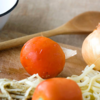 Simmer in a tomato-onion base 