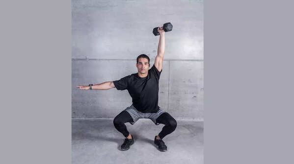 Squat into shoulder press (Using light weights or bottles)