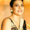 Understated elegance: Inky black saree with pearl trim