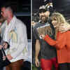 Taylor Swift hugging Travis from the side