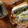High-purine foods (sardines, anchovies, organ meats, beer)