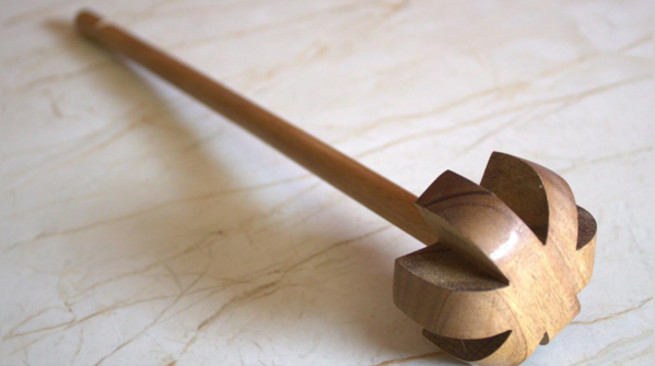 Madani: the wooden churner of patience