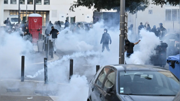 Protesters throw objects; police retaliate with tear gas