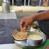 Sit in a cross-legged posture on the floor and eat