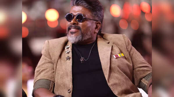 Dhanush surprises R Parthiban