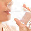 How does drinking water before a warm shower help