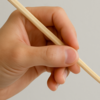 Step 3 - Hold the top stick like a pencil