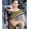 The beige and green designer saree