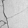Cracks in walls, ceilings, or floors