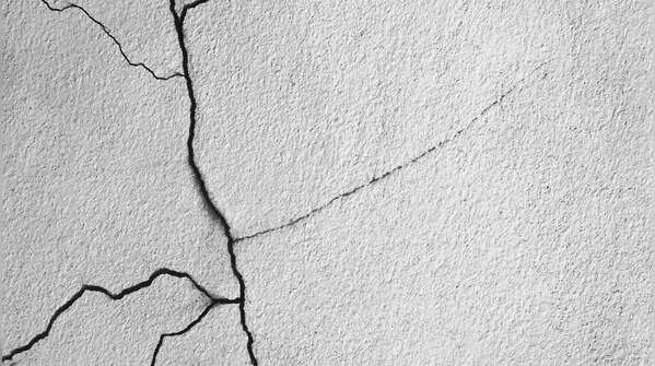 Cracks in walls, ceilings, or floors
