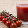 How is tomato juice linked to hair growth?