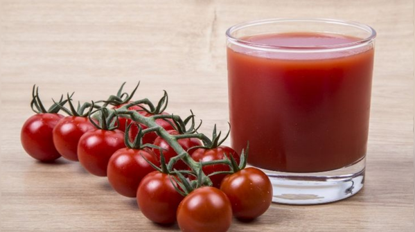 How is tomato juice linked to hair growth?