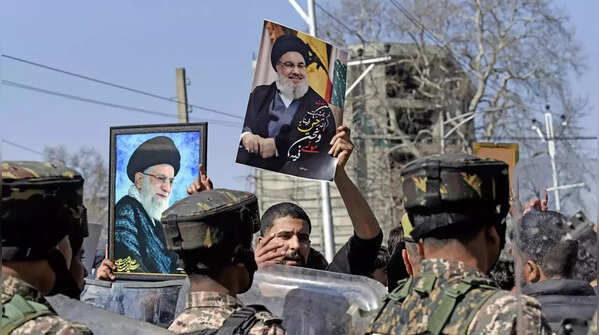 Black flags, portraits displayed