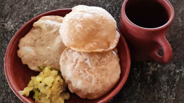 Luchi and Aloo Posto