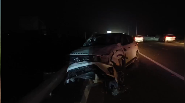 Vehicle hits divider