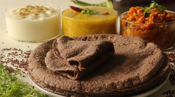 Peanut and sesame chutney with millet roti