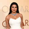 Oscar Awards: Priyanka Chopra steps up on the red carpet in her custom white gown with a thigh high slit and feather detailing. The actress will be one of the presenters at the ceremony.