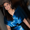 Shines Bright in a Sculpted Blue Metallic Dress