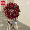 Article image for: Fans Gather At <i class="tbold">Chuck Norris</i>’ Walk Of Fame Star As Flowers Mark Emotional Farewell