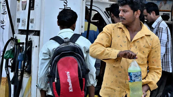 Motorists seen carrying cans and bottles to store fuel