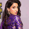 Nora Fatehi makes a case for minimal glam in purple saree