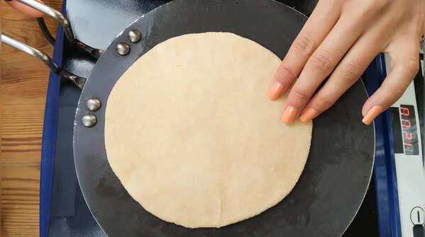 Step 4: Cook the rotis in stages