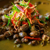 Snails cooked with coconut and spices