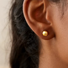 Minimal round or diamond-shaped gold studs