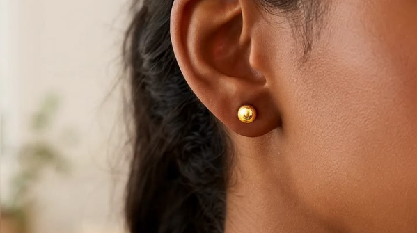 Minimal round or diamond-shaped gold studs