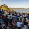 Onlookers gather to photograph and celebrate this historic moment. 