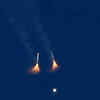 Article image for: Rocket boosters on <i class="tbold">NASA</i>'s Artemis II moon rocket fall away after lifting off.