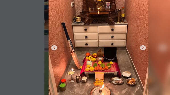 Pooja room with his cricket bat