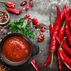 Chilli peppers become hot sauce