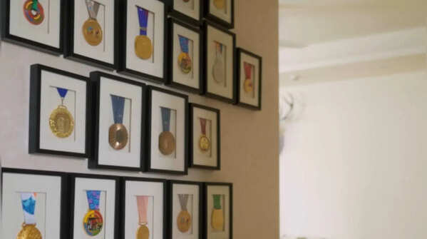 Trophy wall showcasing her journey