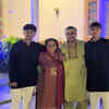 With his sons and mother
