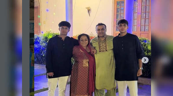 With his sons and mother