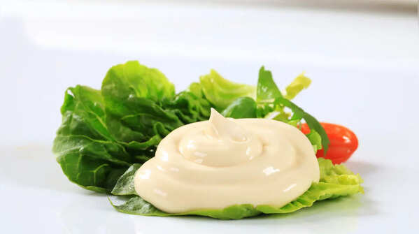 How can raw-egg mayonnaise pose a health hazard?